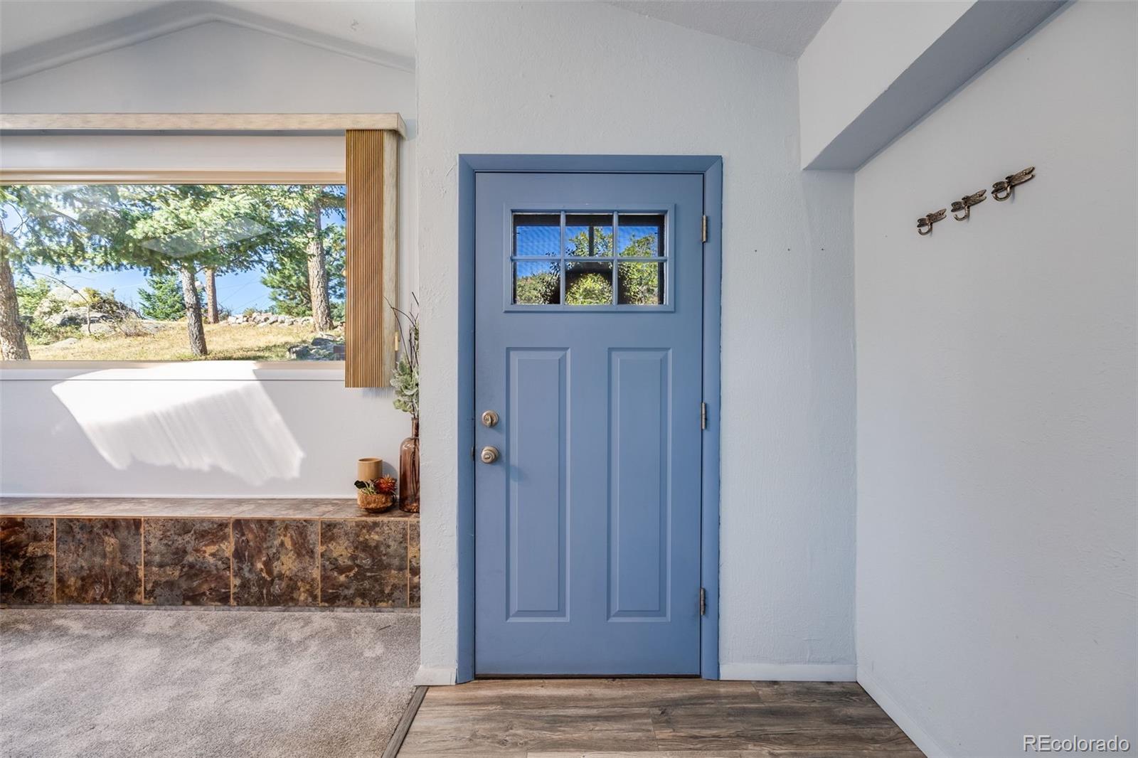 8644 Doubleheader Ranch Road Morrison, CO 80465 - Photo 3 of 36 a view of entrance door of the house