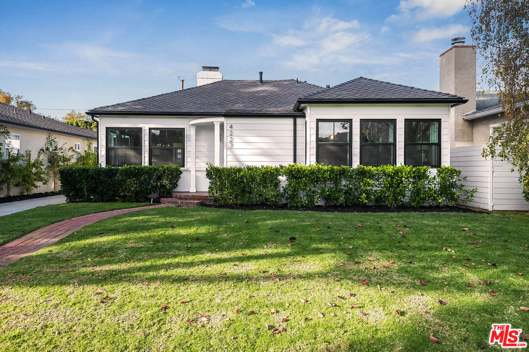 4227 Warner Boulevard Burbank, CA 91505 - Photo 12 of 41 a front view of a house with a yard