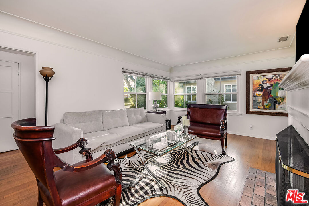 4227 Warner Boulevard Burbank, CA 91505 - Photo 15 of 41 a living room with furniture and a flat screen tv