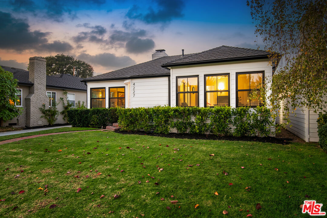 4227 Warner Boulevard Burbank, CA 91505 - Photo 40 of 41 a front view of a house with garden