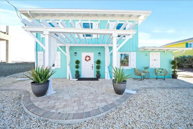 a view of a house with porch and sitting area