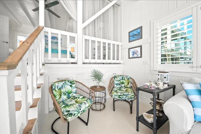 a spacious bedroom with a bed and a table in it