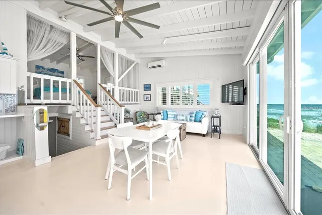 a view of a dining room with furniture window and outside view