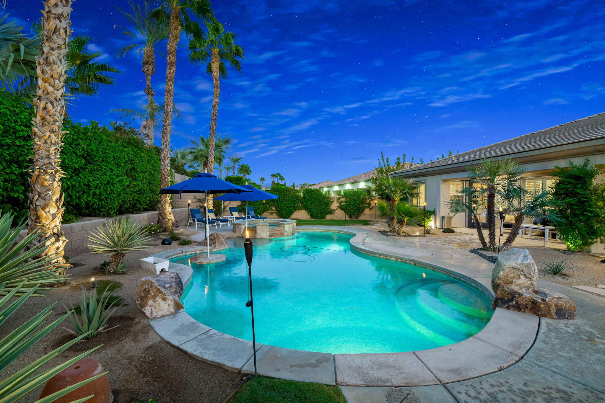 80676 Plum Lane Indio, CA 92201 - Photo 15 of 26 a view of a swimming pool with a patio
