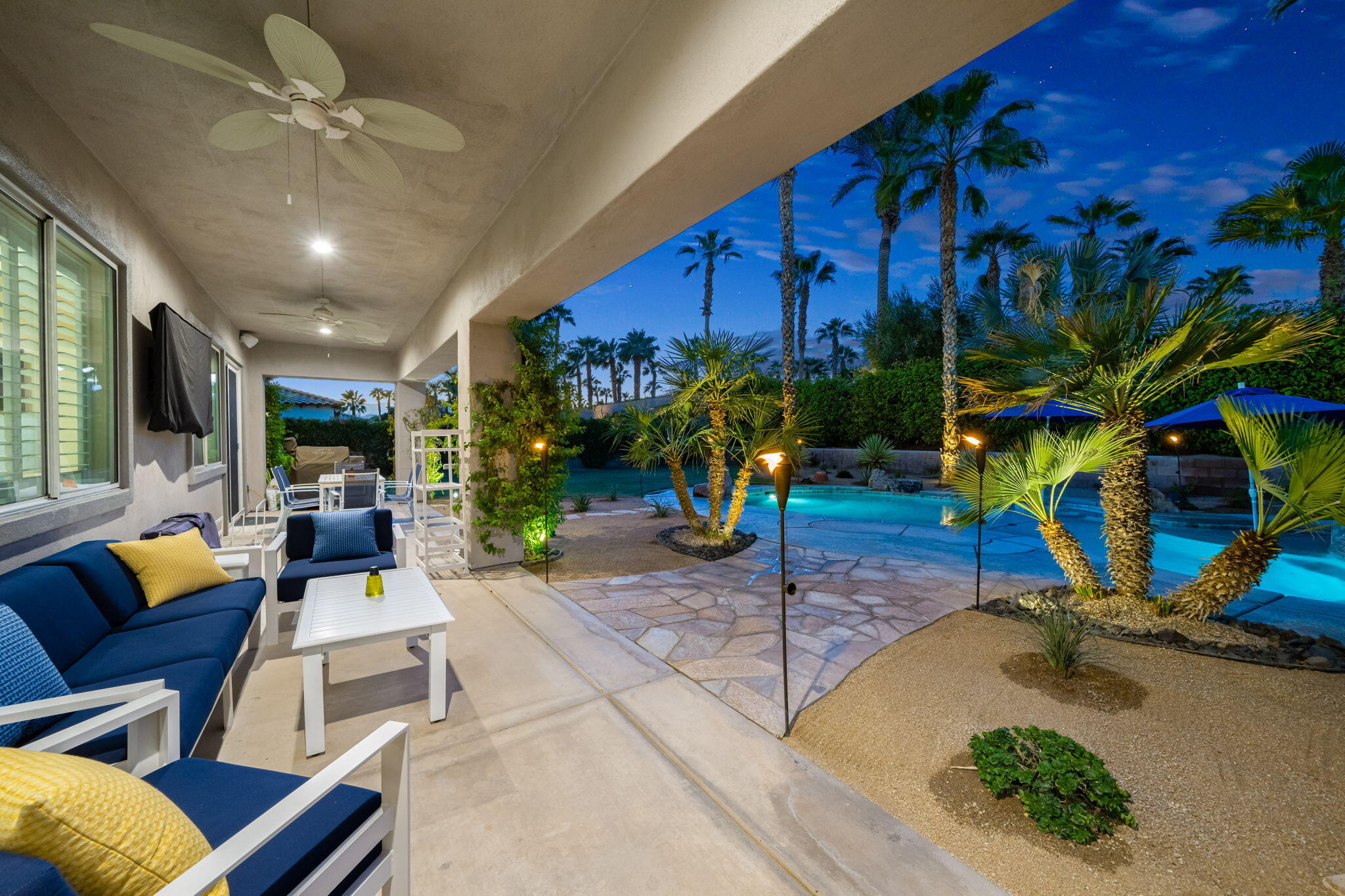 80676 Plum Lane Indio, CA 92201 - Photo 21 of 26 a living room with patio furniture and a potted plant