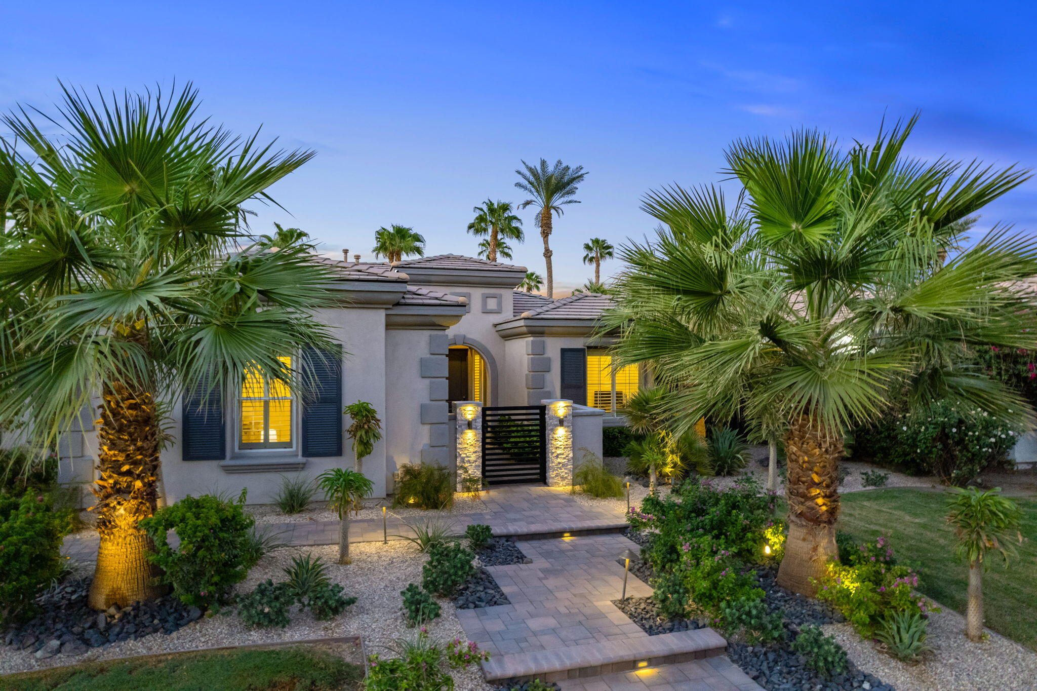 80676 Plum Lane Indio, CA 92201 - Photo 3 of 26 a front view of a house with garden