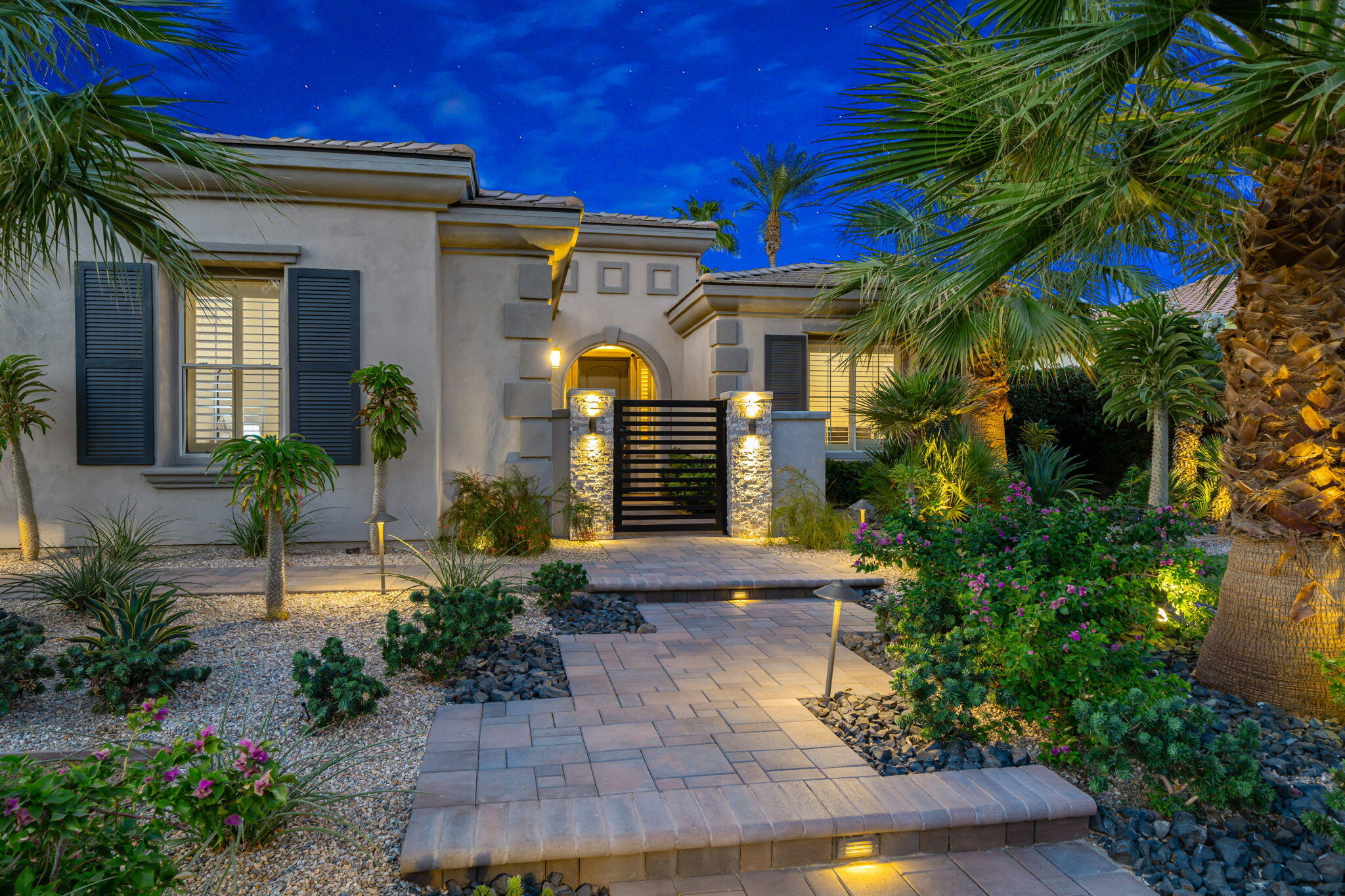 80676 Plum Lane Indio, CA 92201 - Photo 4 of 26 a front view of a house with garden