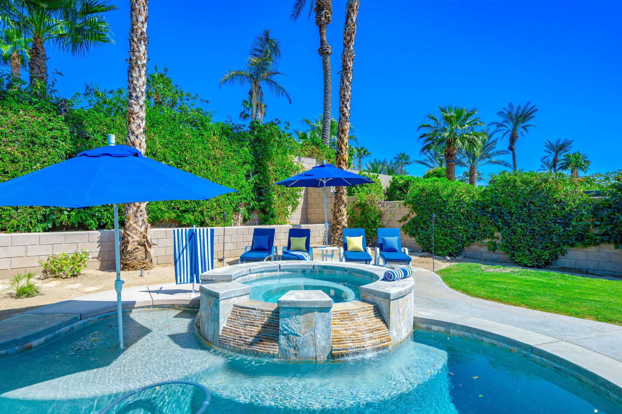 80676 Plum Lane Indio, CA 92201 - Photo 10 of 26 a view of a house with backyard sitting area and pool