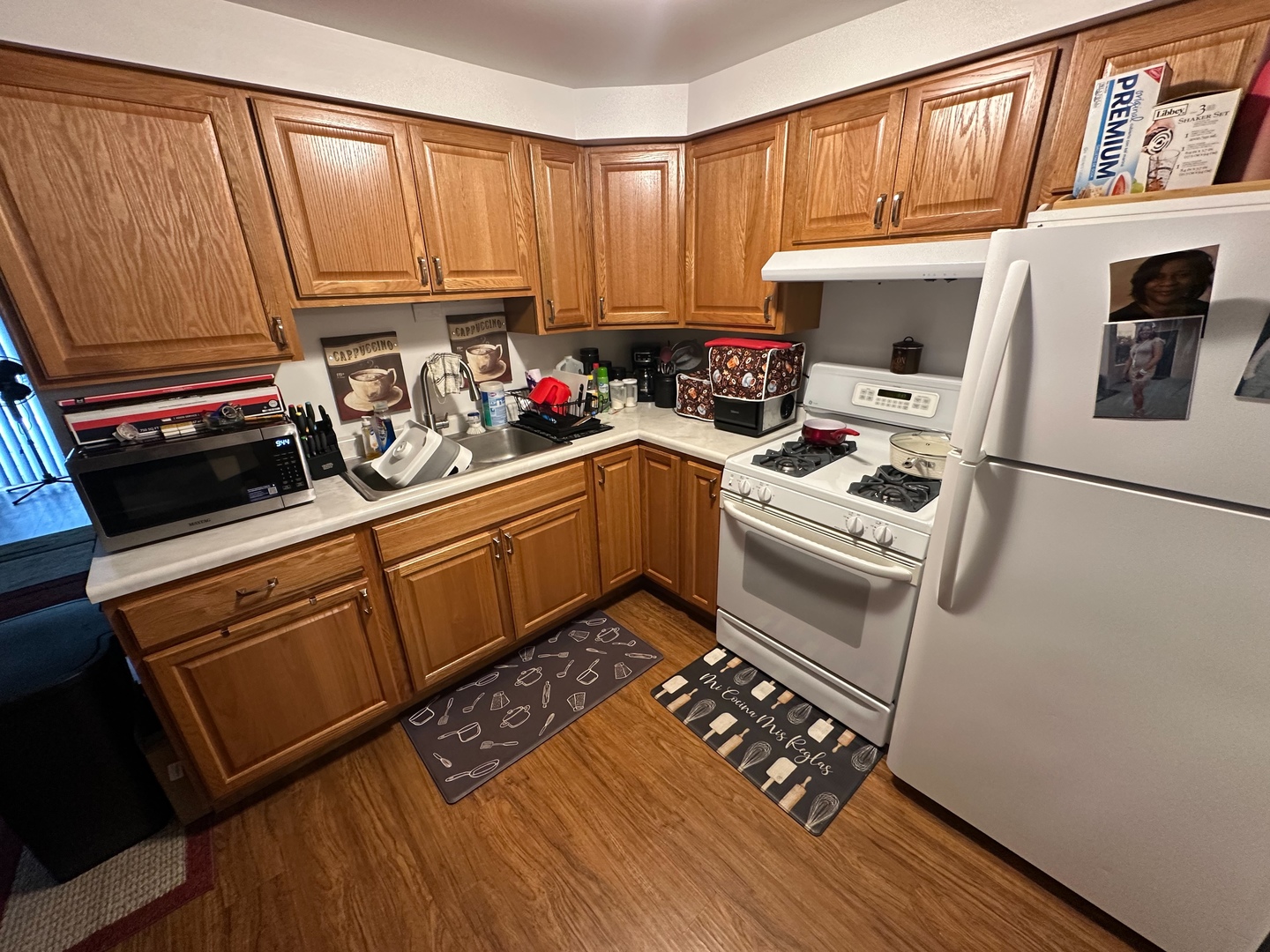 2121 176th Place Lansing, IL 60438 - Photo 11 of 26 a kitchen with granite countertop a stove sink and cabinets
