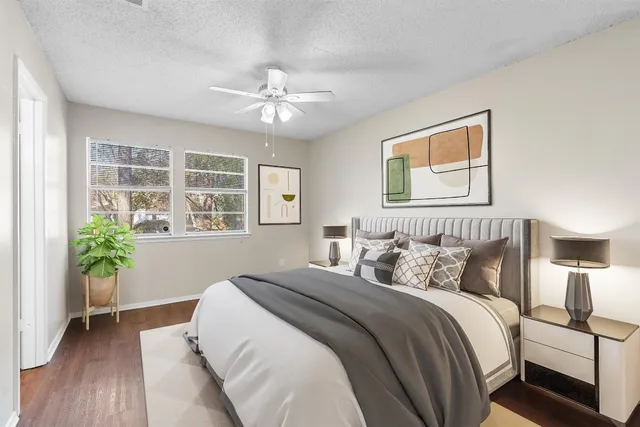 a bedroom with bed and a window