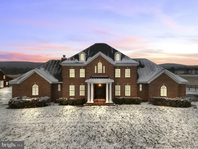 a kitchen with stainless steel appliances granite countertop a stove refrigerator sink and cabinets