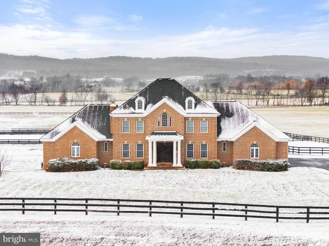 a bathroom with a sink and mirror with toilet