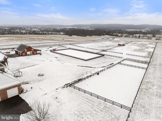a room with a desk and wooden floor