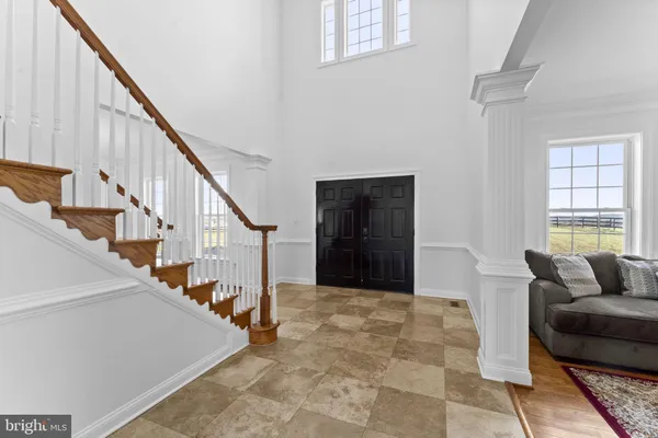 a kitchen with stainless steel appliances granite countertop a sink a stove and cabinets