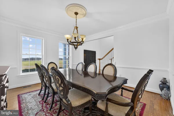 a bathroom with a sink and mirror with toilet