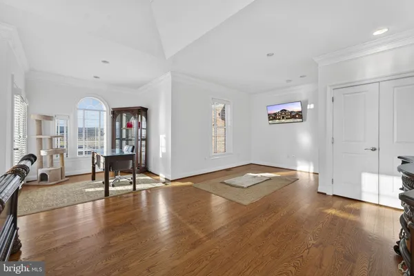 a large kitchen with stainless steel appliances granite countertop a refrigerator and a sink