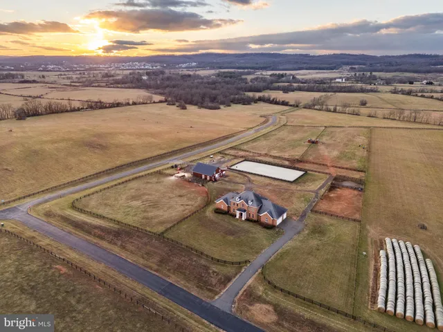a living room with furniture a rug and a window