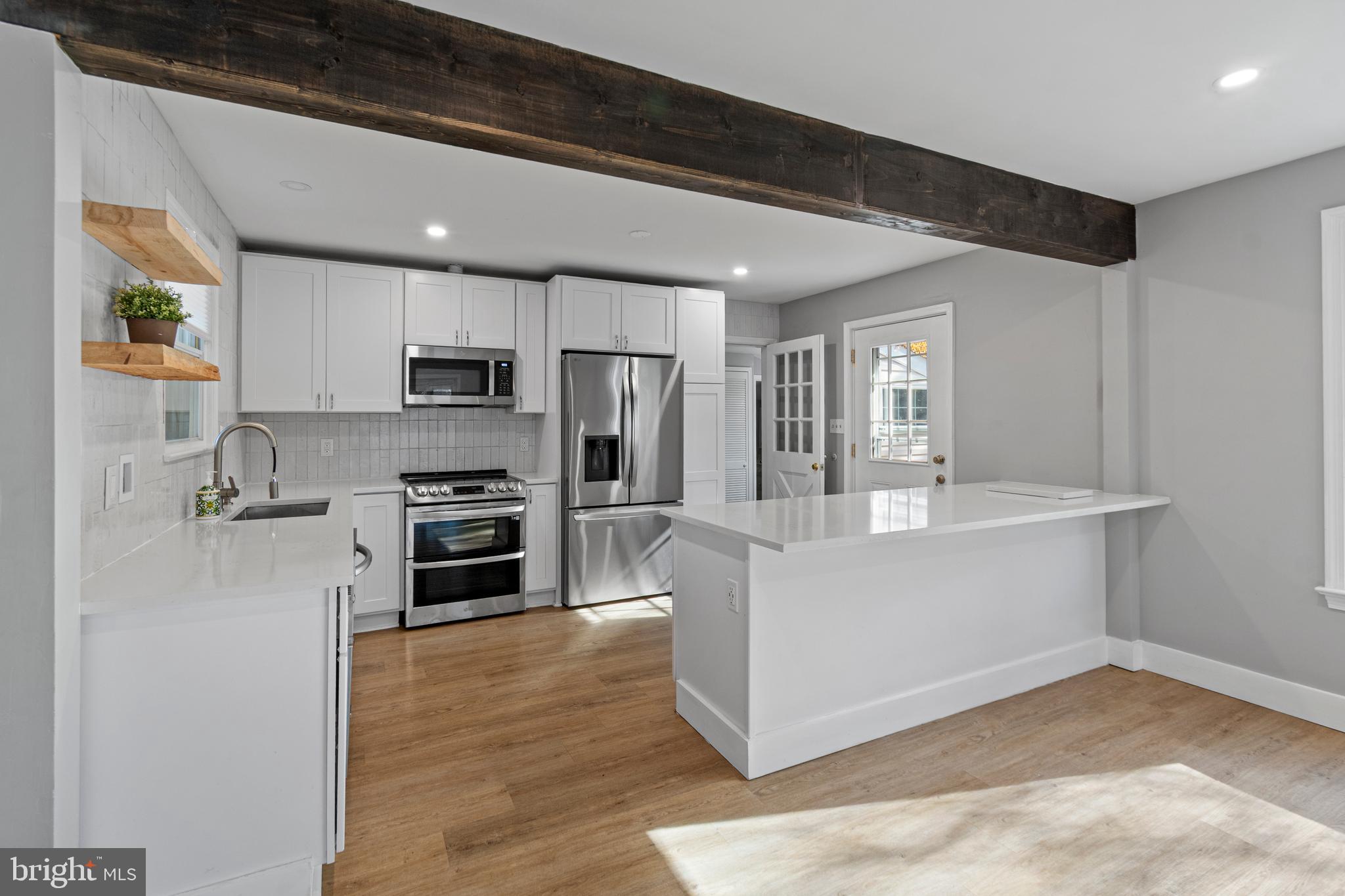 9 Robinson Road Severna Park, MD 21146 - Photo 11 of 51 a view of kitchen with microwave and cabinets