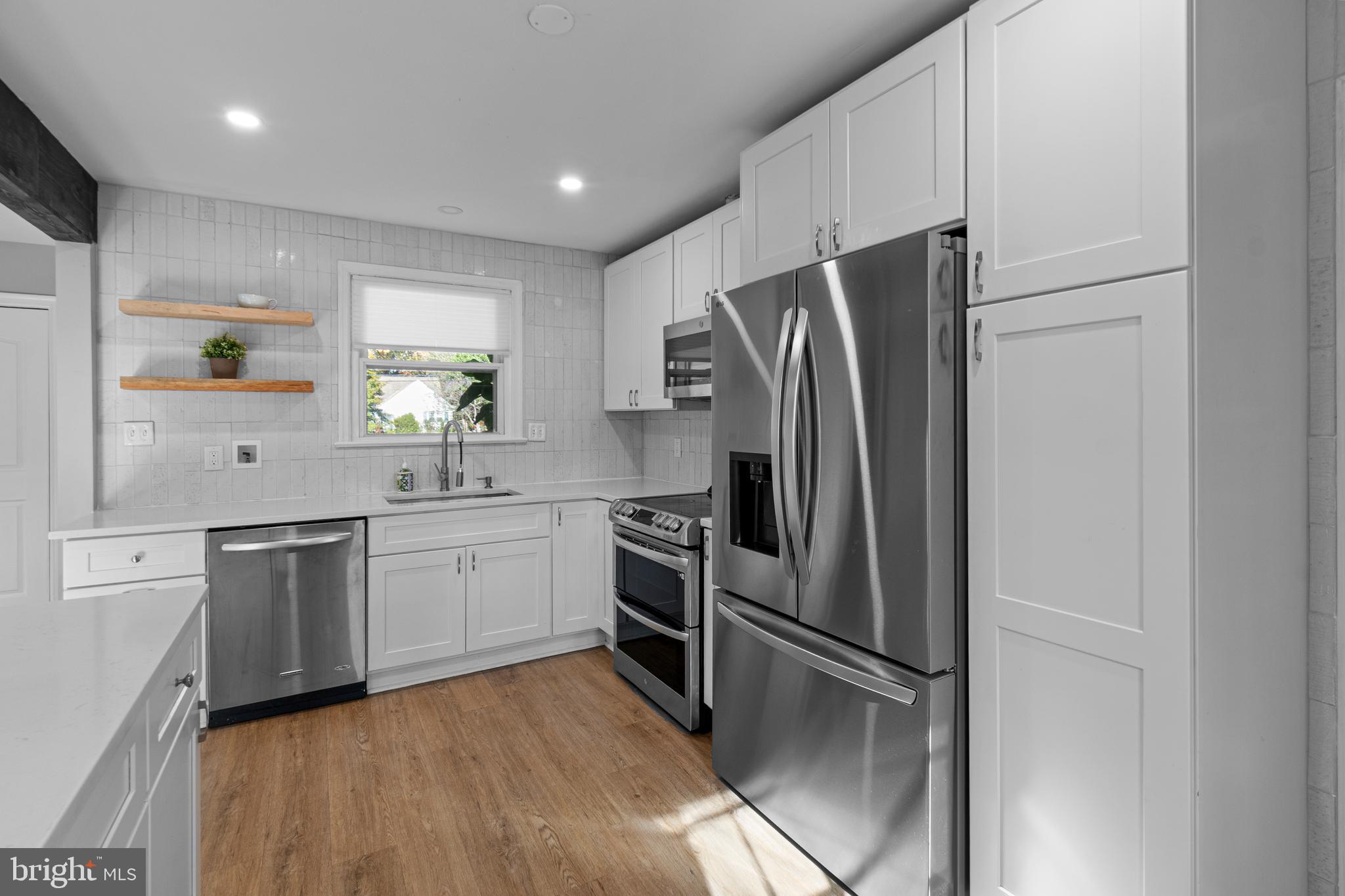 9 Robinson Road Severna Park, MD 21146 - Photo 16 of 51 a kitchen with a refrigerator and a sink