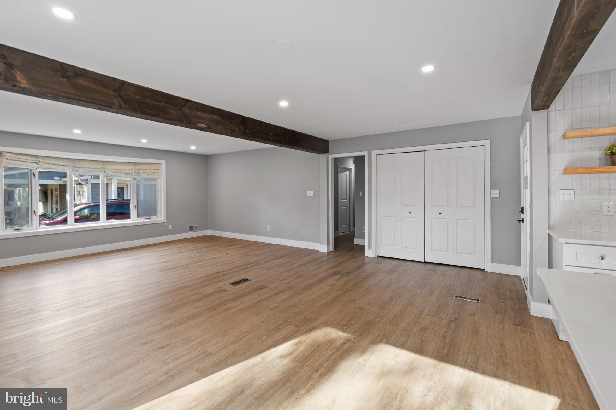 9 Robinson Road Severna Park, MD 21146 - Photo 2 of 51 a view of an empty room with wooden floor and a window