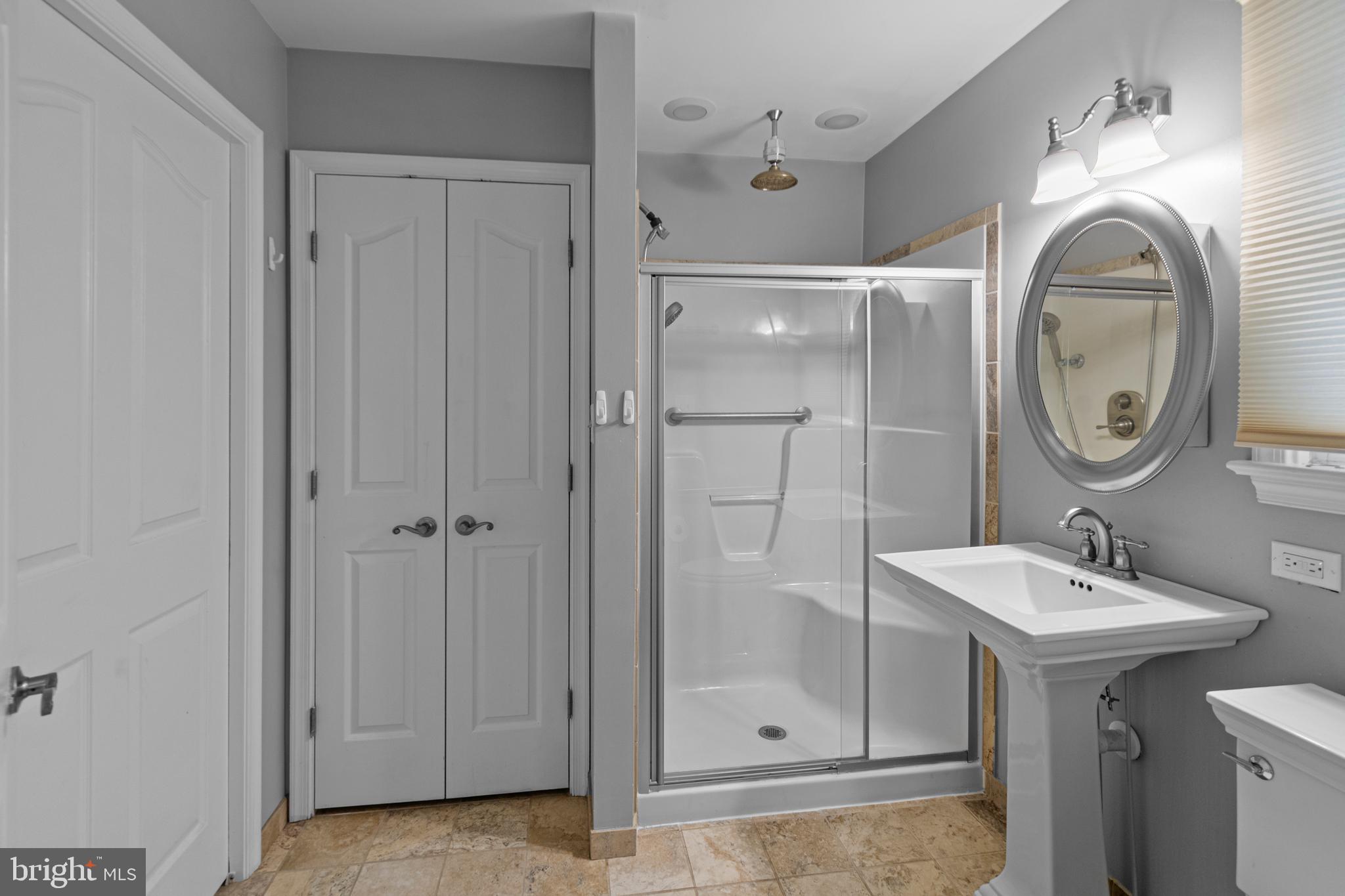 9 Robinson Road Severna Park, MD 21146 - Photo 21 of 51 a bathroom with a sink and a mirror