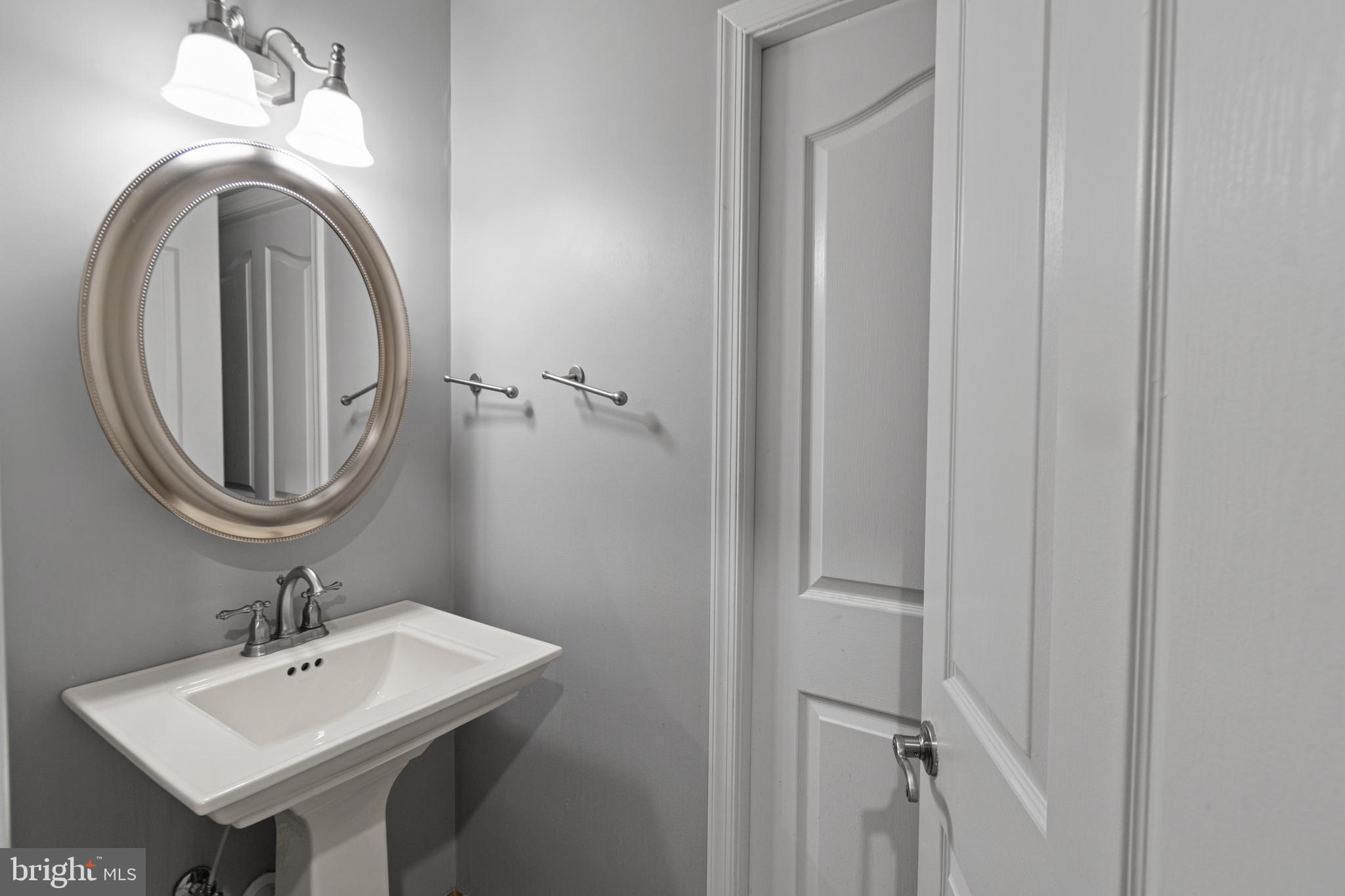 9 Robinson Road Severna Park, MD 21146 - Photo 26 of 51 a bathroom with a sink and a mirror