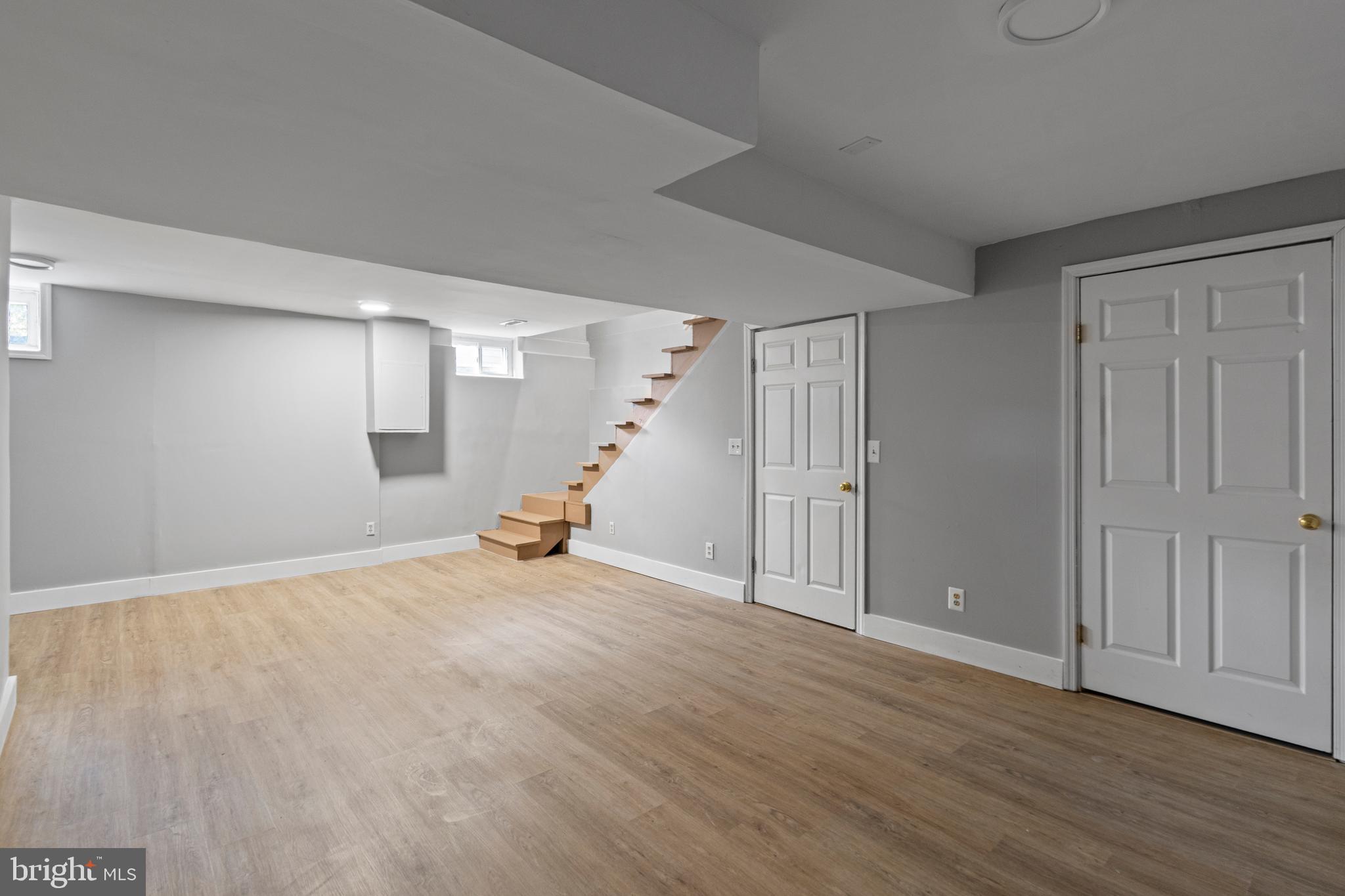 9 Robinson Road Severna Park, MD 21146 - Photo 37 of 51 a view of a livingroom with wooden floor and stairs