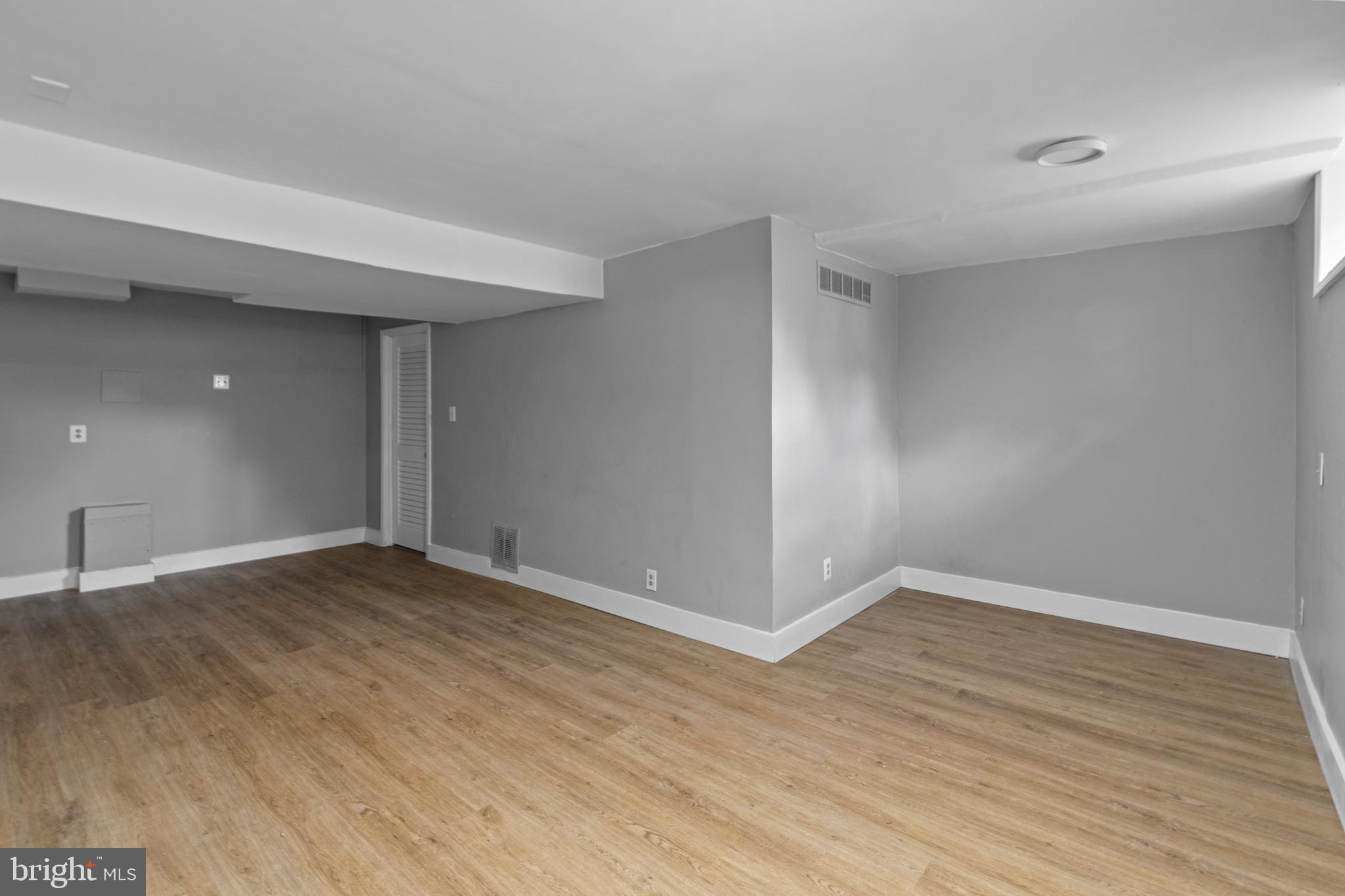 9 Robinson Road Severna Park, MD 21146 - Photo 38 of 51 a view of an empty room with wooden floor