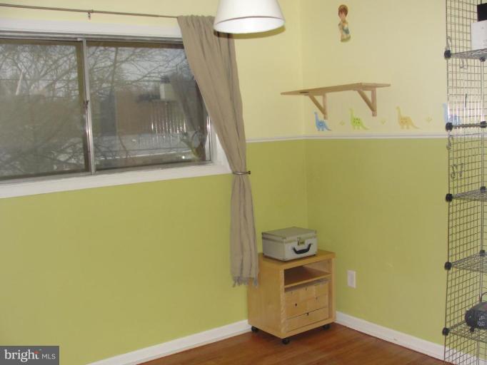 511 Waterford Road Silver Spring, MD 20901 - Photo 14 of 20 a view of a small space with wooden floor and a window
