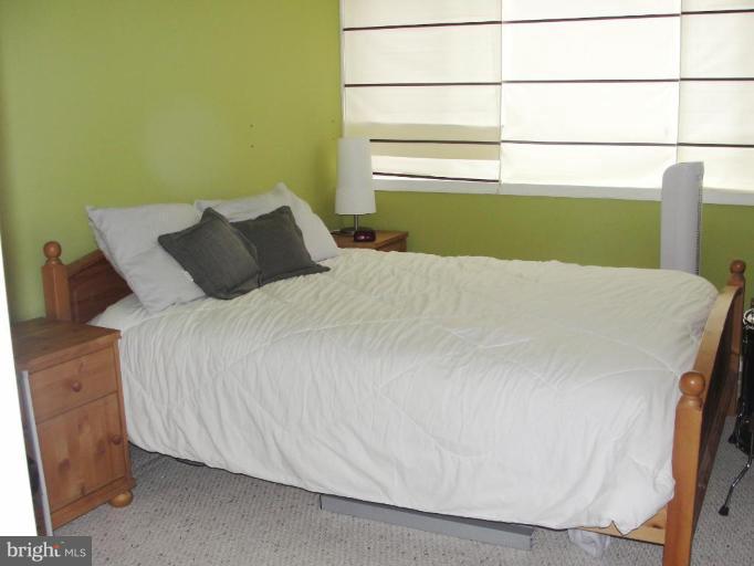 511 Waterford Road Silver Spring, MD 20901 - Photo 18 of 20 a bedroom with a bed and a window