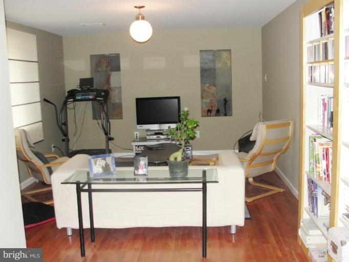 511 Waterford Road Silver Spring, MD 20901 - Photo 20 of 20 a dining room with furniture a wooden floor and a chandelier