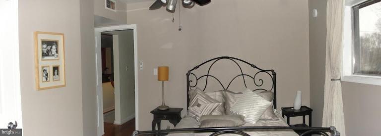 511 Waterford Road Silver Spring, MD 20901 - Photo 7 of 20 a picture of a room with wooden floor and windows