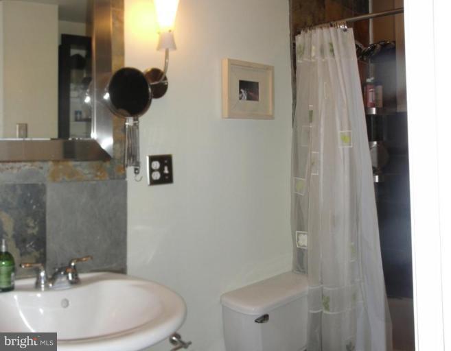 511 Waterford Road Silver Spring, MD 20901 - Photo 9 of 20 a bathroom with a sink and shower
