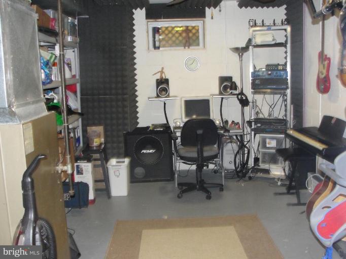 511 Waterford Road Silver Spring, MD 20901 - Photo 10 of 20 a view of gym equipment with racks on the wall