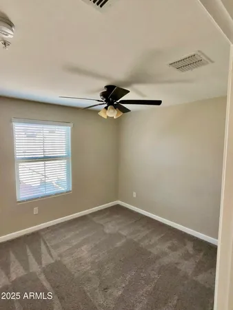 a view of a livingroom with a ceiling fan