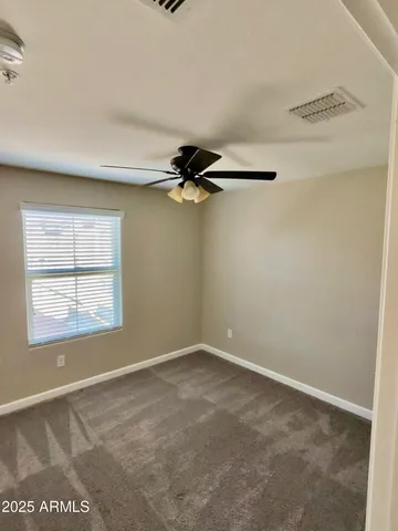 a view of a livingroom with a ceiling fan