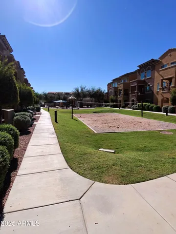 a view of a patio with a yard