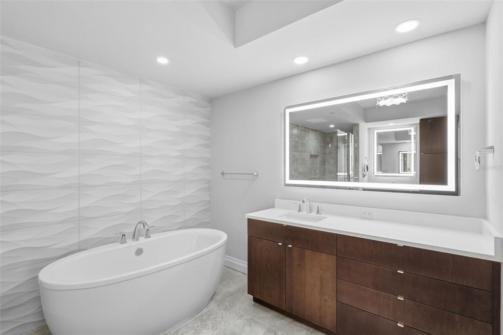 800 Collany Road, Unit 302 St. Petersburg, FL 33715 - Photo 64 of 66 a bathroom with a bathtub and a sink