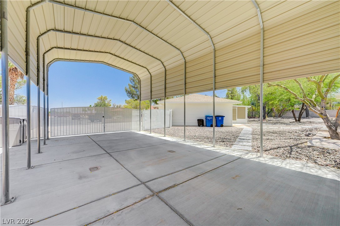 7631 Bermuda Road Las Vegas, NV 89123 - Photo 37 of 64 A spacious covered carport and driveway provide ample parking and outdoor utility.
