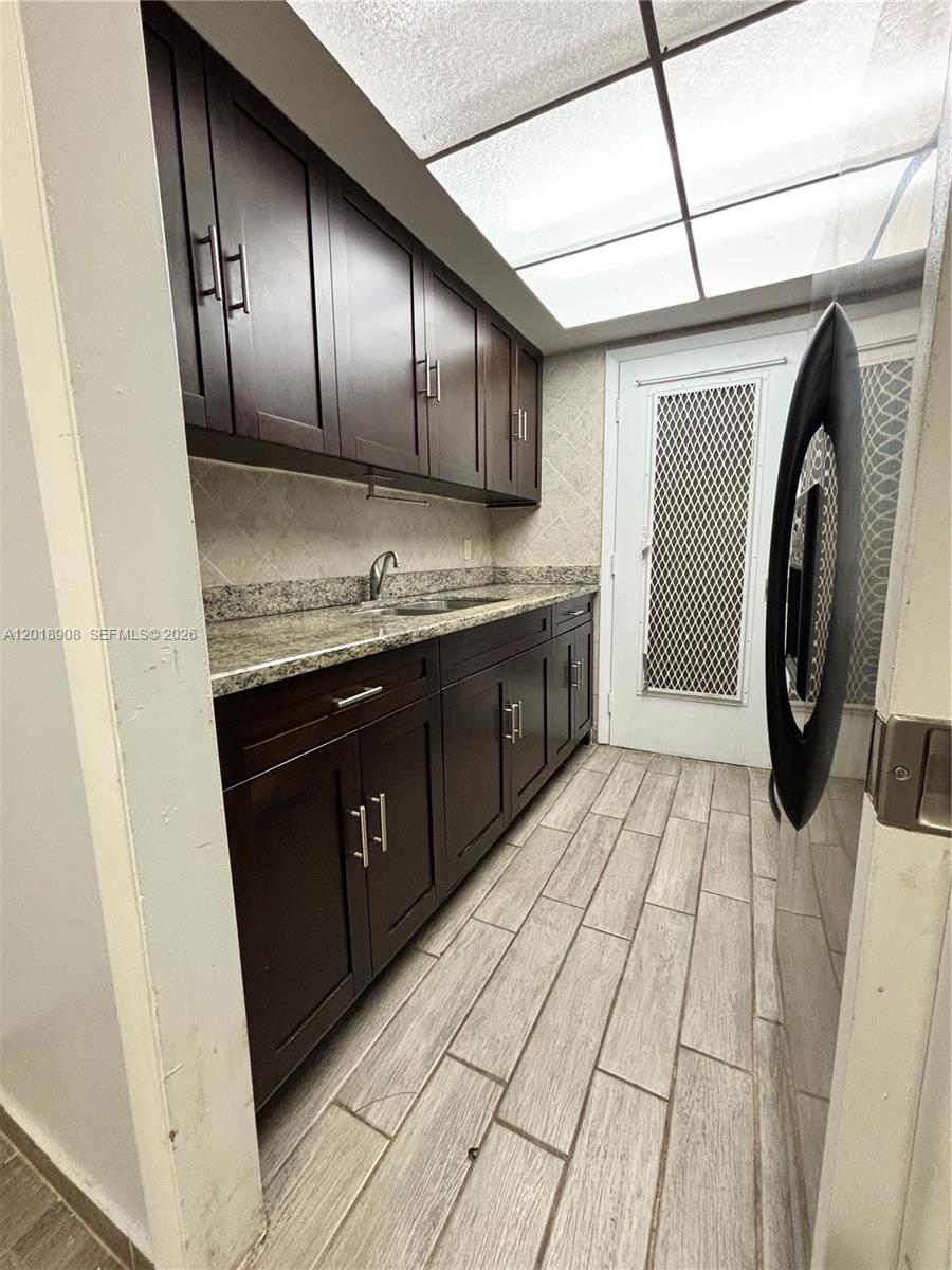 1480 East Sample Road, Unit 209 Pompano Beach, FL 33064 - Photo 11 of 24 a bathroom with a sink and a mirror