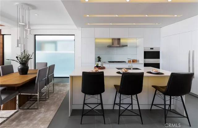 a dining room with a table and chairs