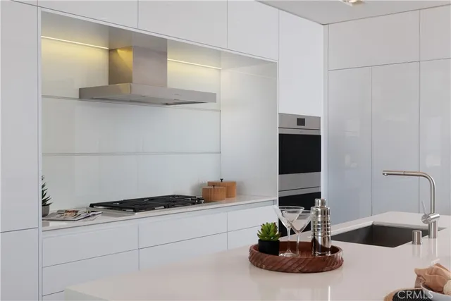 a kitchen with a sink and cabinets