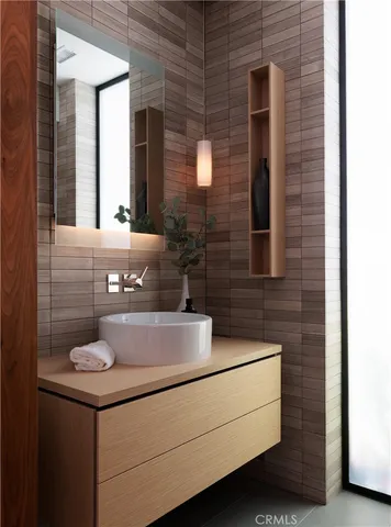 a bathroom with a sink and a mirror