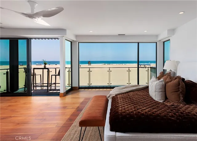 a bedroom with a large bed and a large window