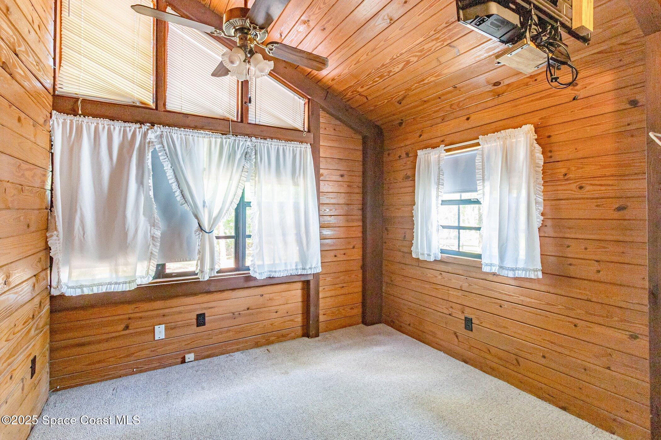 630 Chase Hammock Road Merritt Island, FL 32953 - Photo 22 of 37 a bathroom with a bathtub and a window
