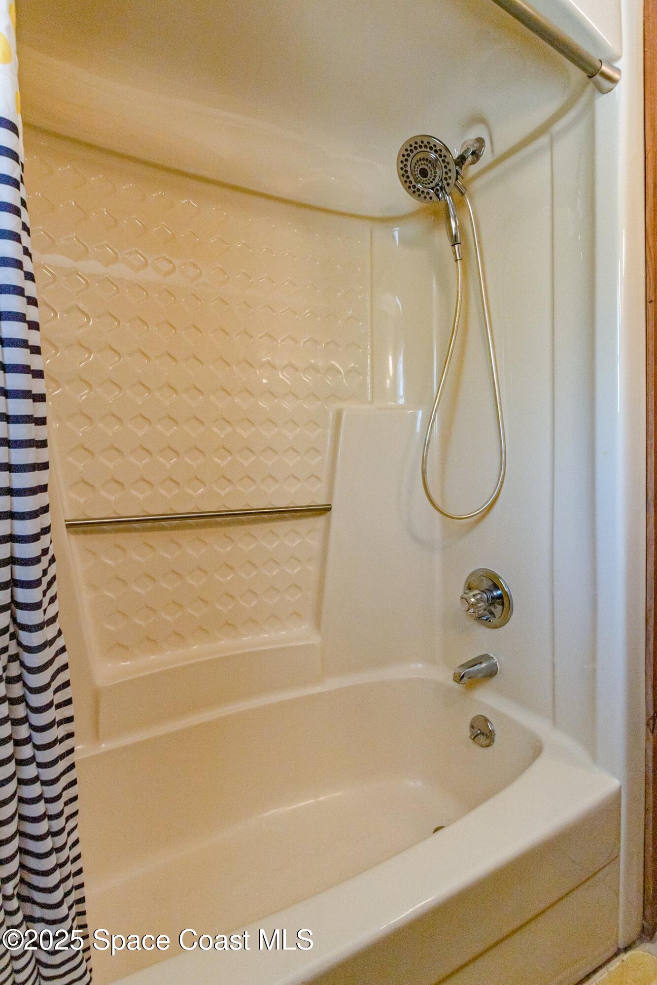 630 Chase Hammock Road Merritt Island, FL 32953 - Photo 25 of 37 a bathroom with a bath tub and a shower