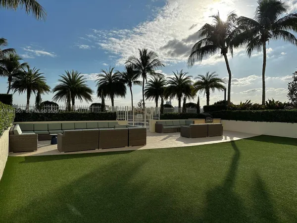 a view of swimming pool with a table and chairs