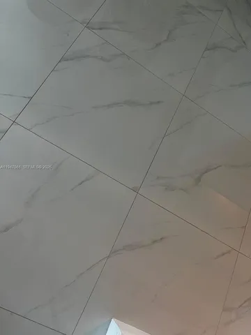 a view of a hallway with stairs