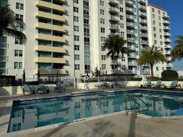 a picture of a swimming pool and outdoor seating