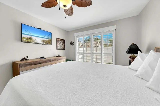 a bed room with a bed and a large window